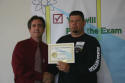 Todd receives his workshop certificate.