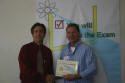 Jon receives his workshop certificate.