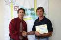 Brett receives his workshop certificate.