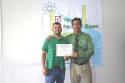 Daniel receives his class certificate