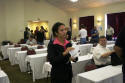 Yvette passes out preparation exam materials.