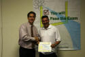 Jorge receives his workshop certificate.